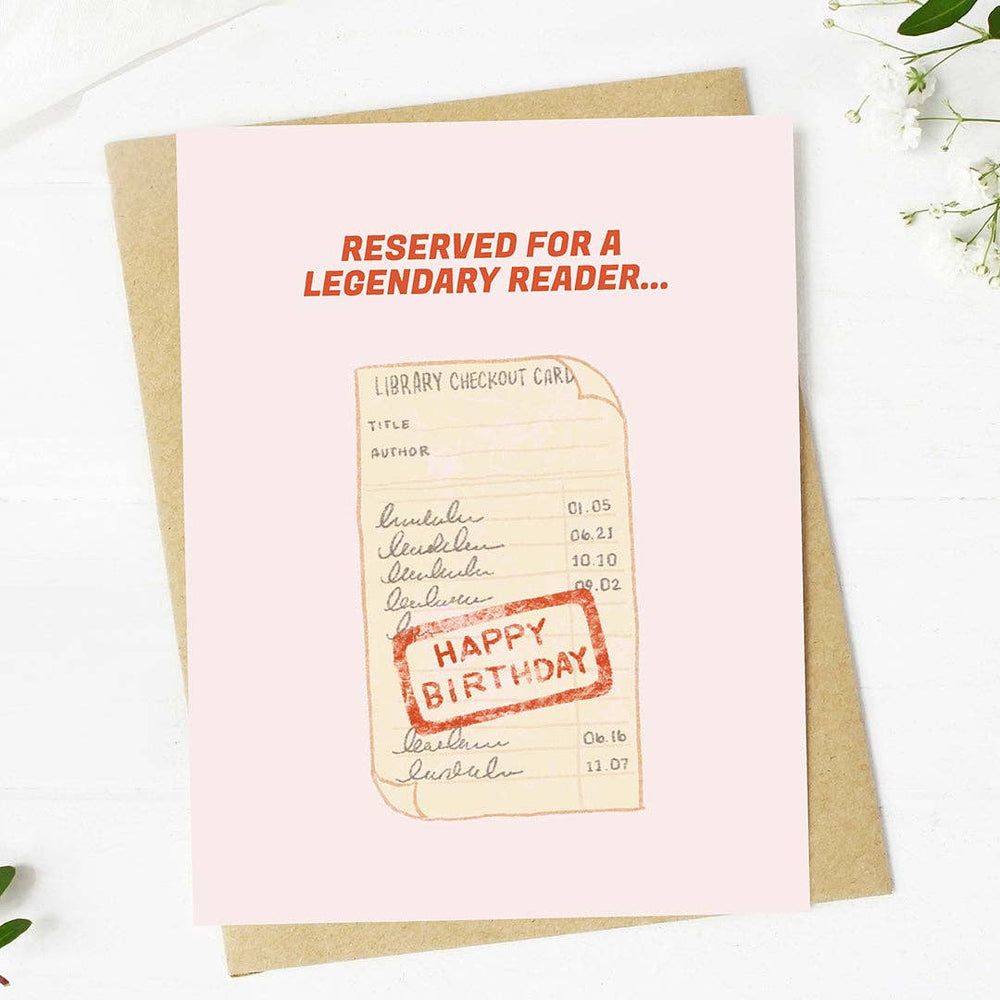 Birthday card with library checkout card design and 'Happy Birthday' stamp on a pink background