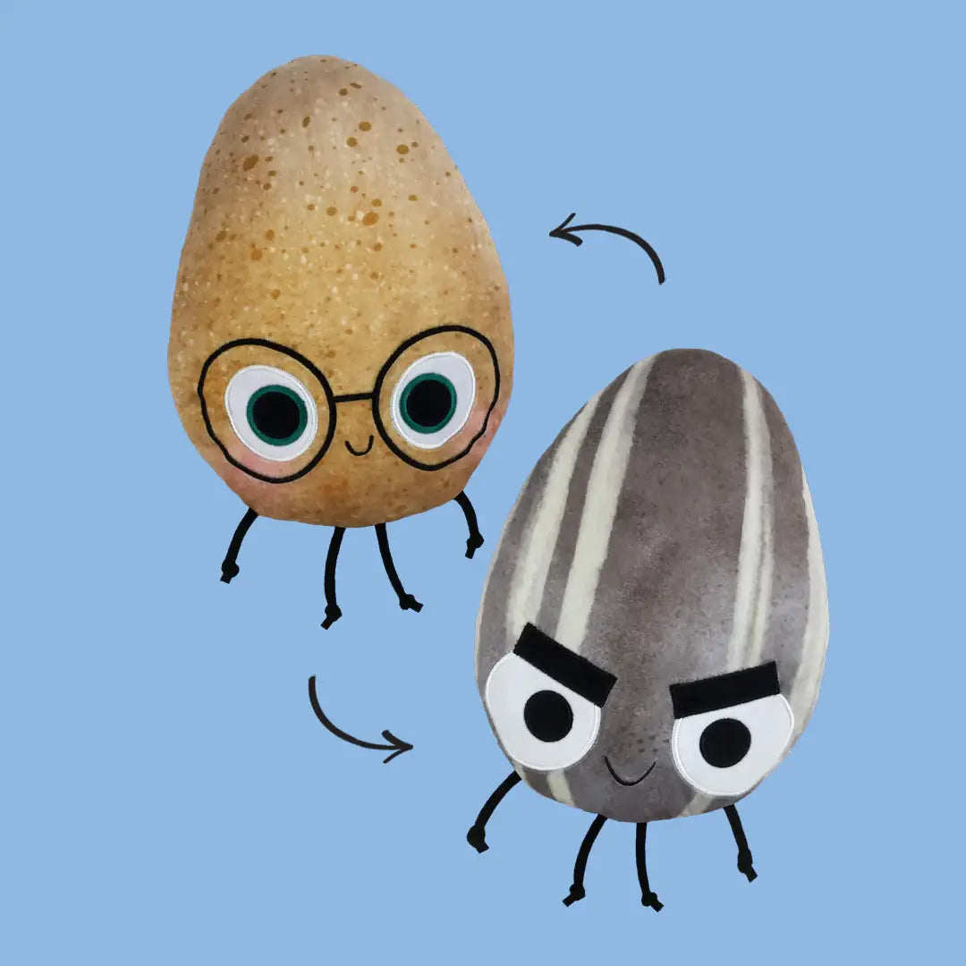 Two plushes with cartoon faces and glasses on a blue background