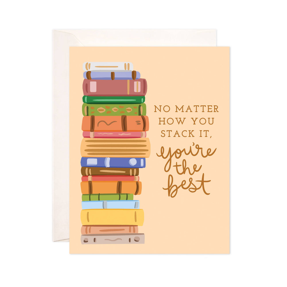 Greeting card with a stack of colorful books and text on a peach background. Text reads 'No matter how you stack it, you're the best'
