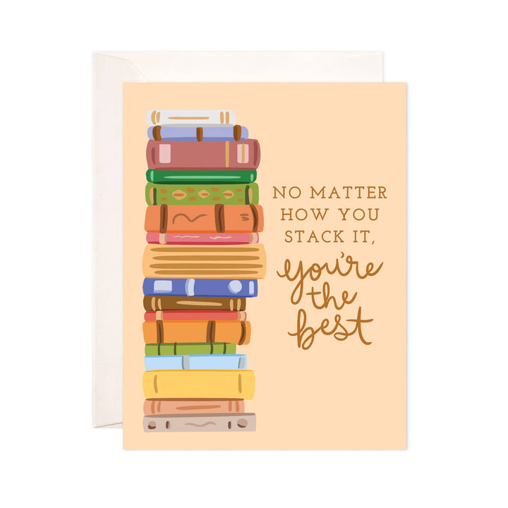 Greeting card with a stack of colorful books and text on a peach background. Text reads &