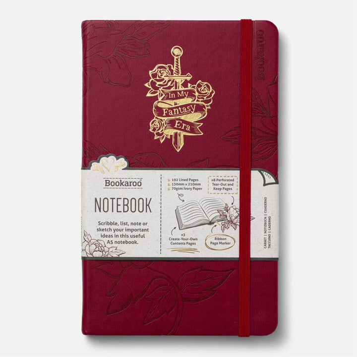 Red notebook with gold design and branding on a white background