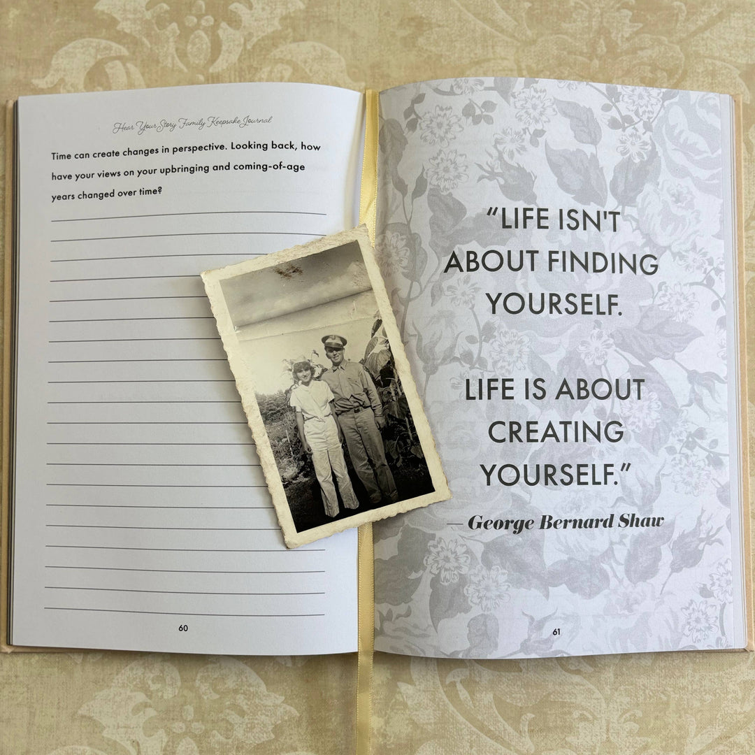 Open book with a photo of two people and a quote by George Bernard Shaw on a floral patterned background.