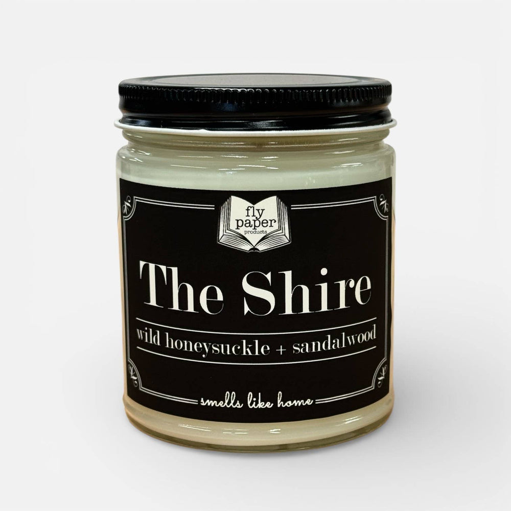 Jar of 'The Shire' candle with a black lid