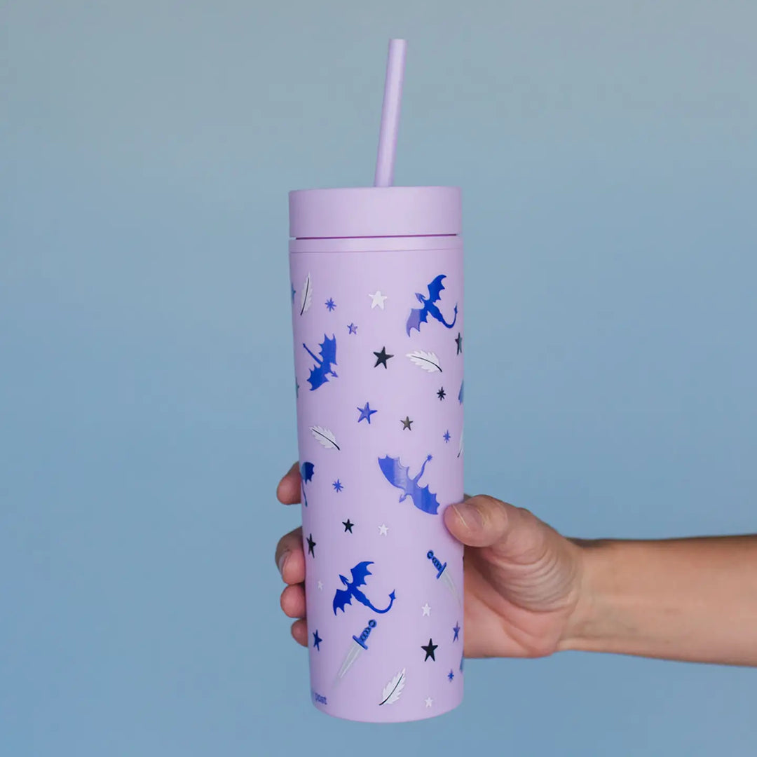 Purple tumbler with blue fairy designs held against a light blue background