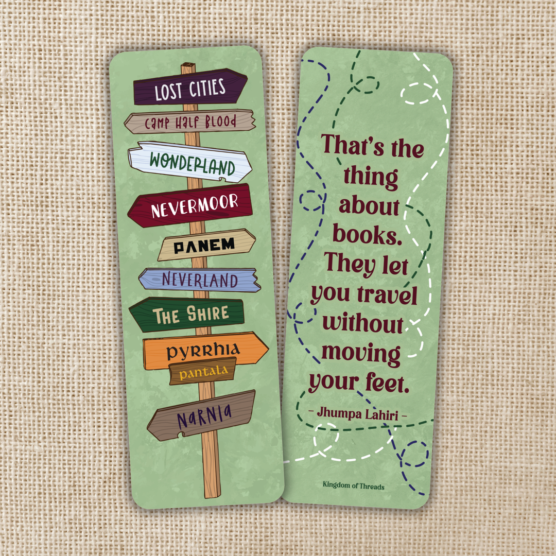Two green bookmarks with text and a wooden signpost design on a beige fabric background.