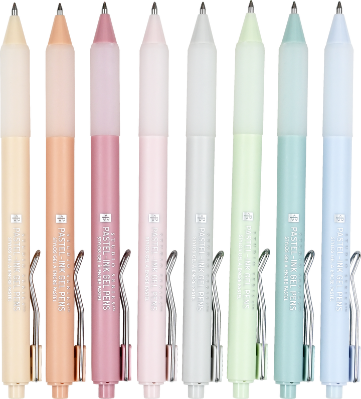 Set of pastel-colored pens with visible brand name on a white background