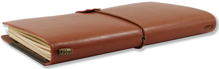 Brown leather notebook with a strap closure on a white background