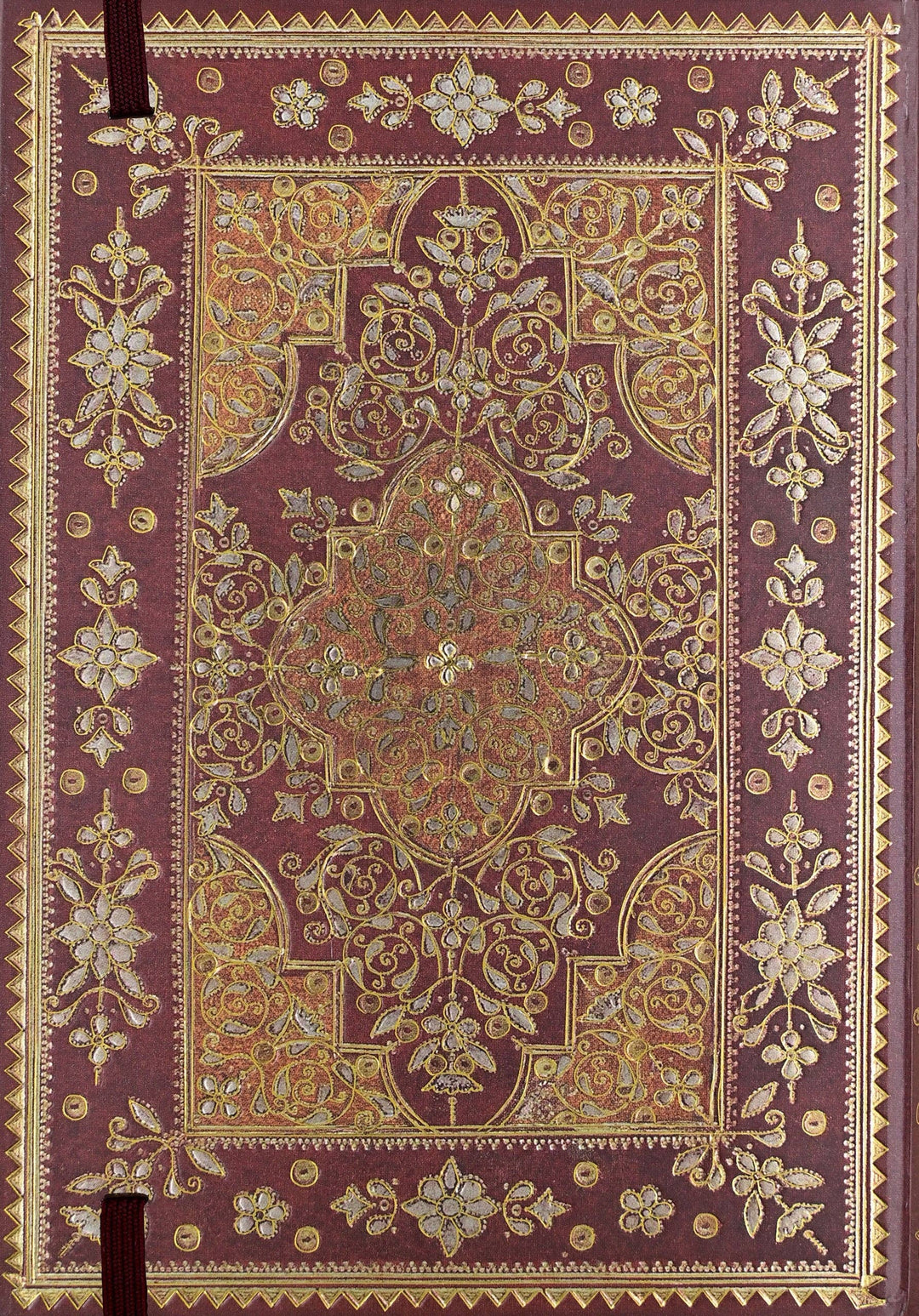 Decorative purple book with intricate gold and beige patterns