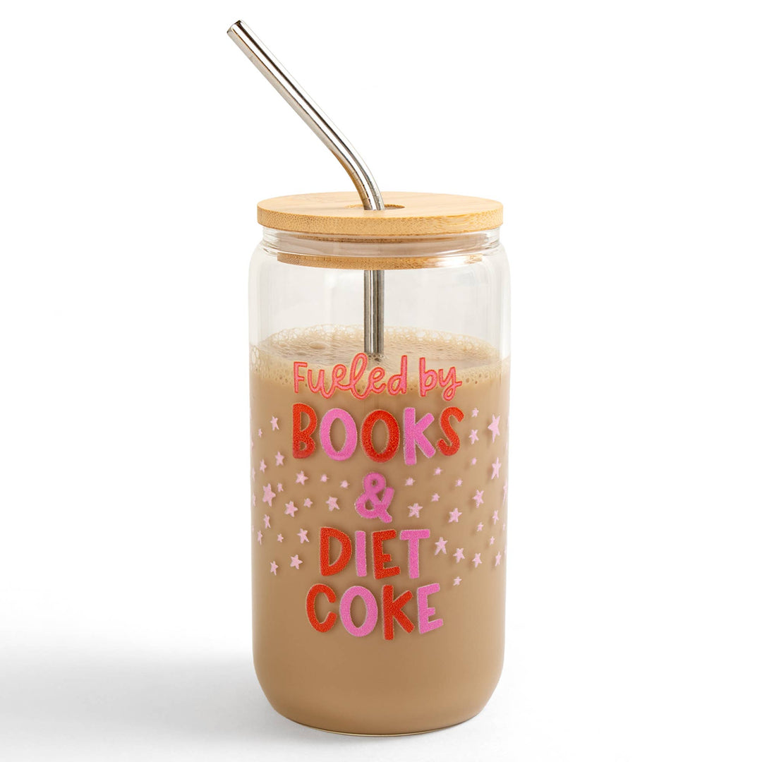 Glass tumbler with wooden lid and straw, filled with a drink, on a white background.