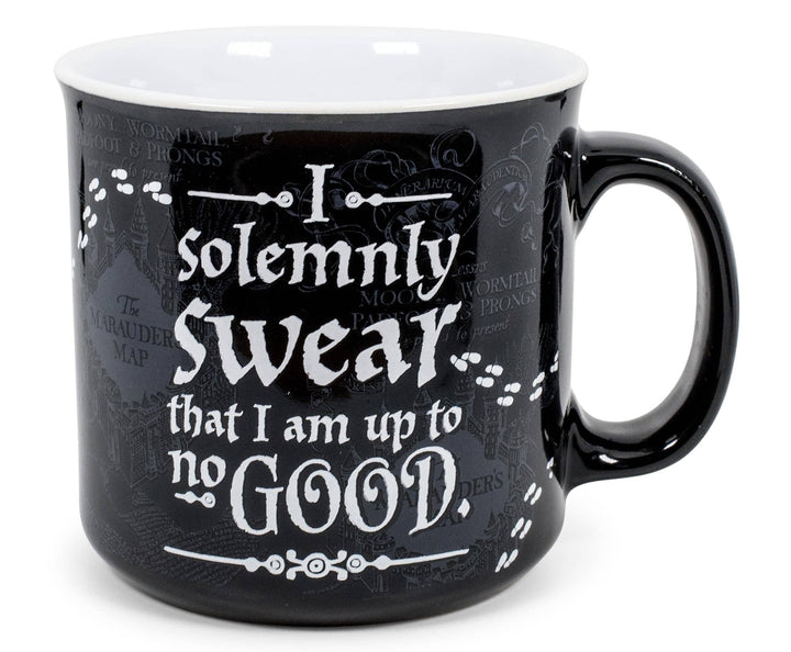 Black mug with white text on a white background