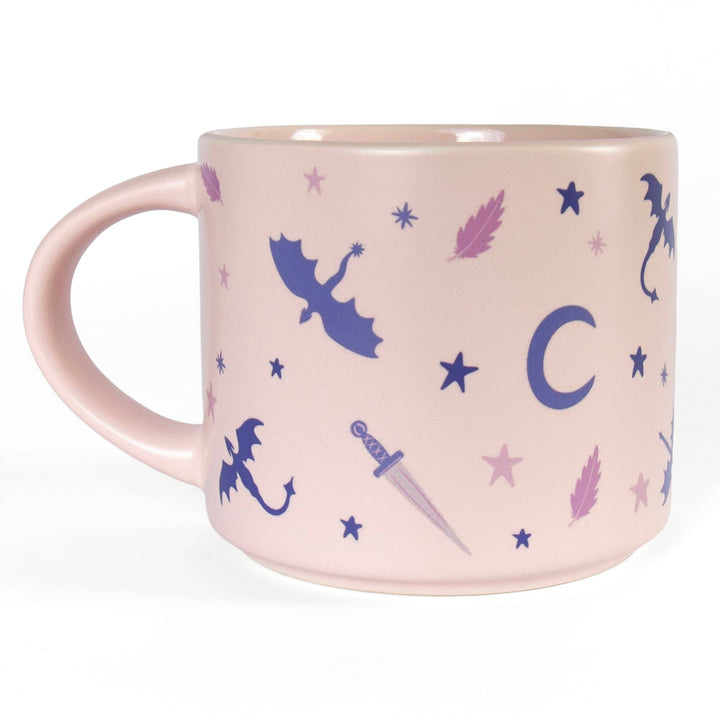 Pink mug with fairy and dragon illustrations on a white background
