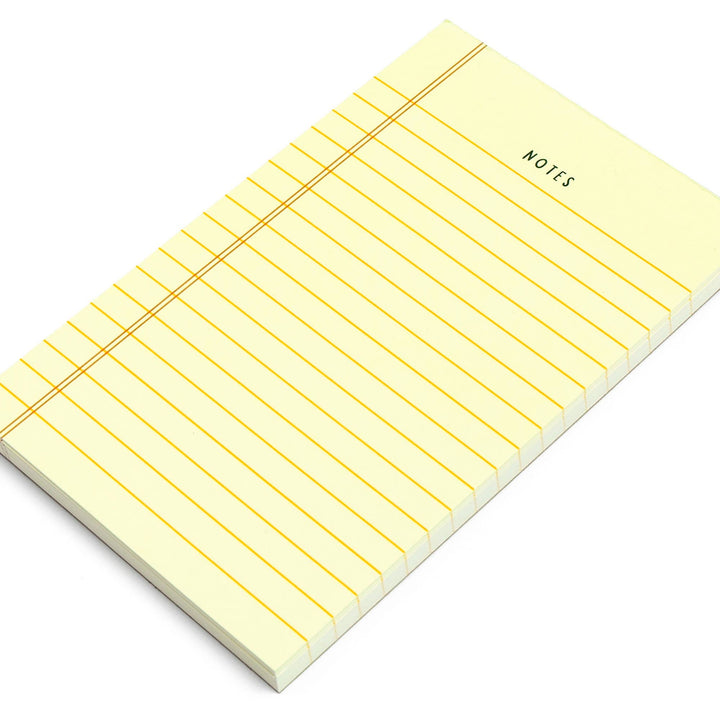 Yellow notepad with grid lines and &