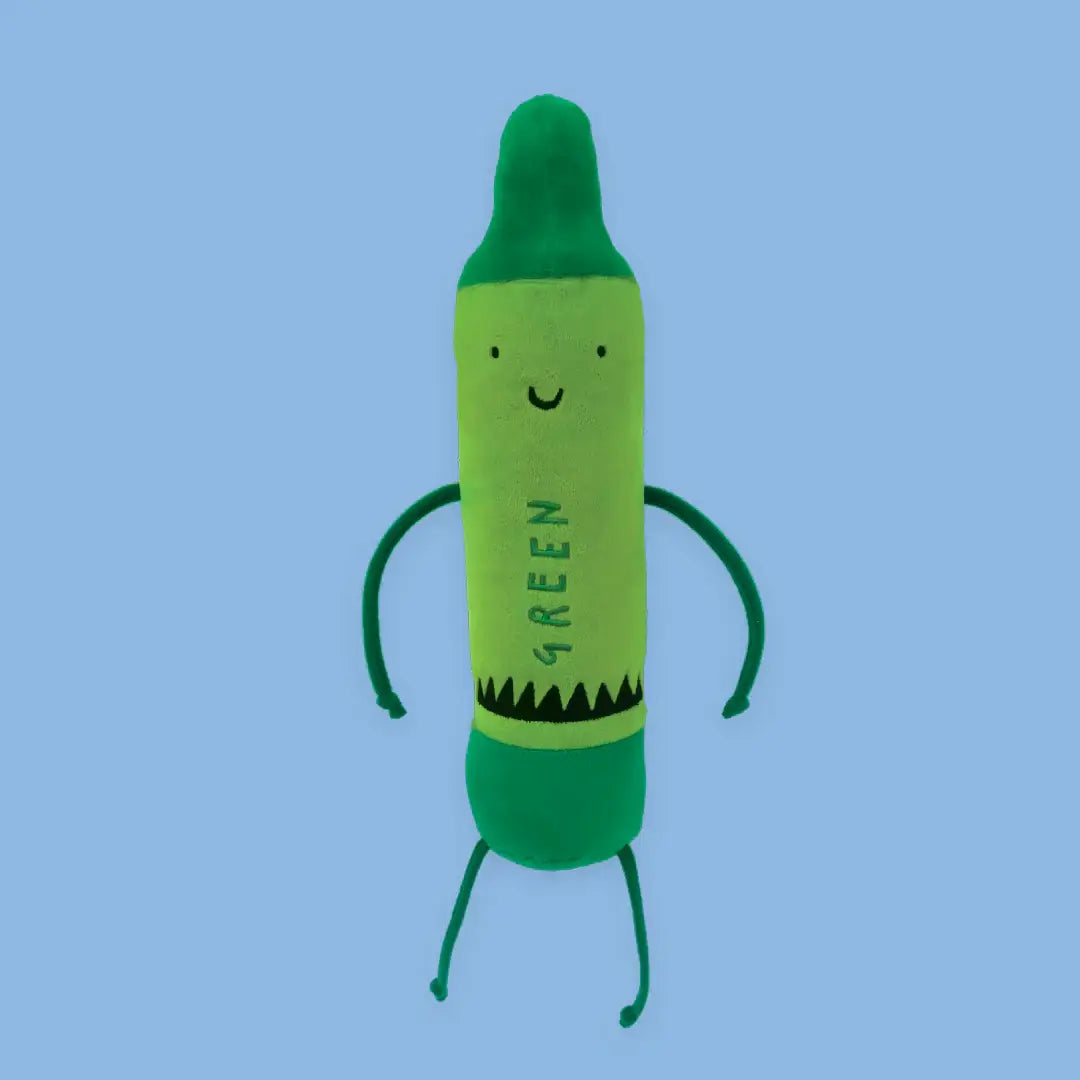 Plush toy shaped like a green crayon with a happy face on a blue background