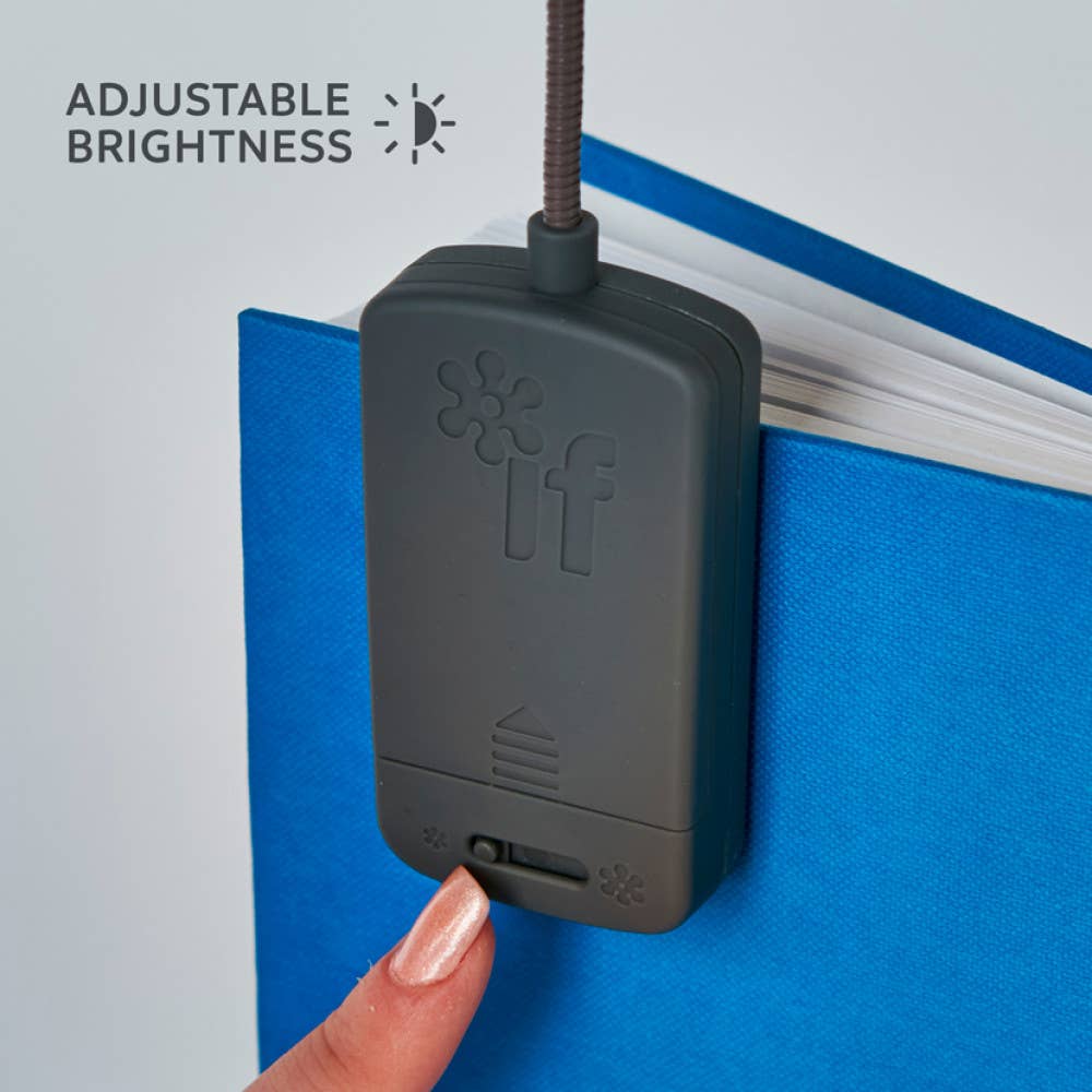 Black adjustable brightness light switch on a blue wall with a hand pressing it.