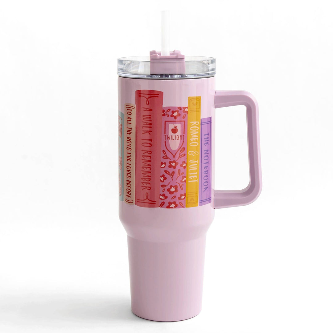 Pink travel mug with a handle on a white background