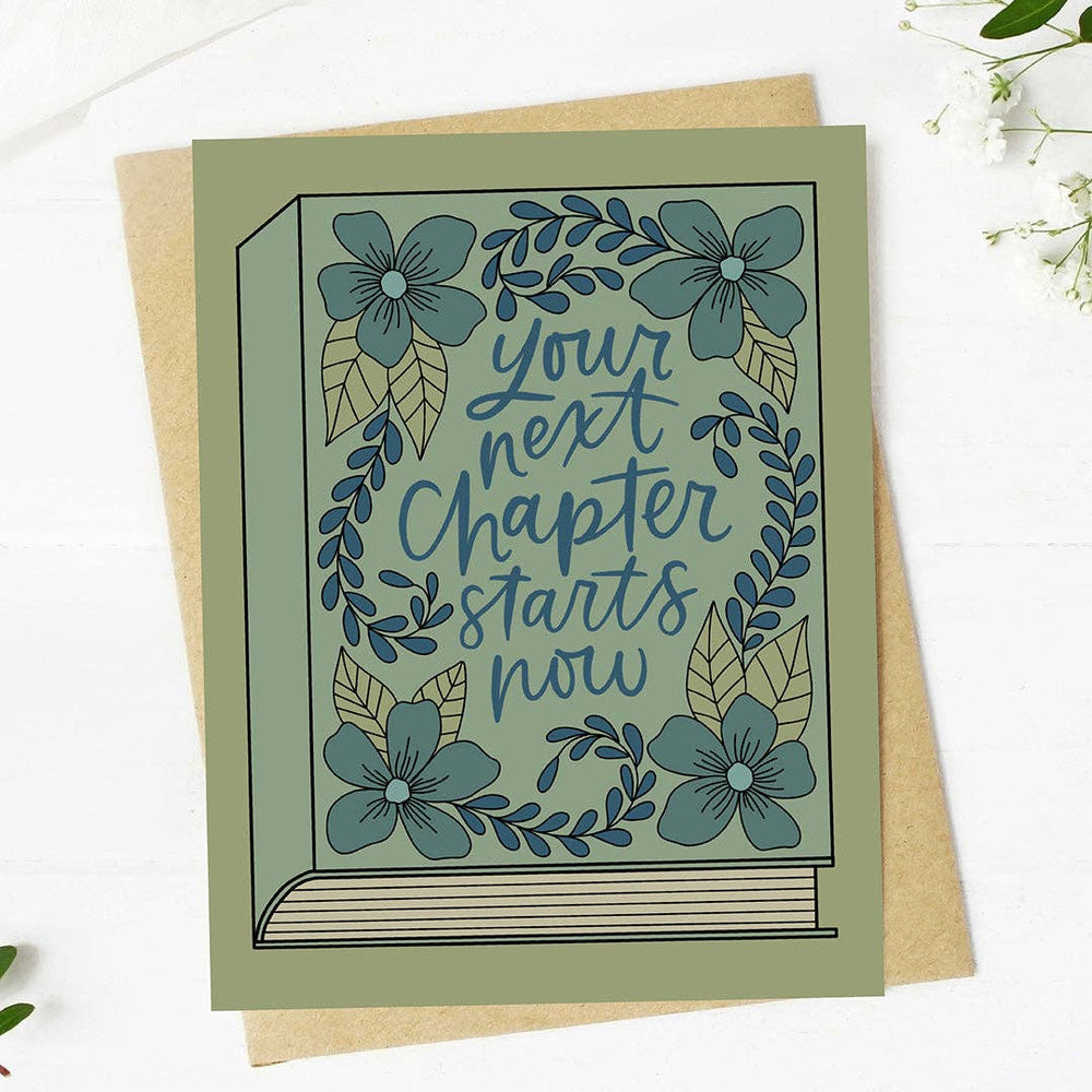 Greeting card with floral design and text 'Your next chapter starts now' on a white background.