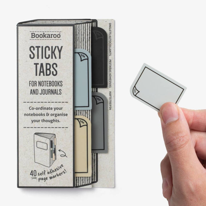 Bookaroo Sticky Tabs packaging with a hand holding a sticky tab on a white background
