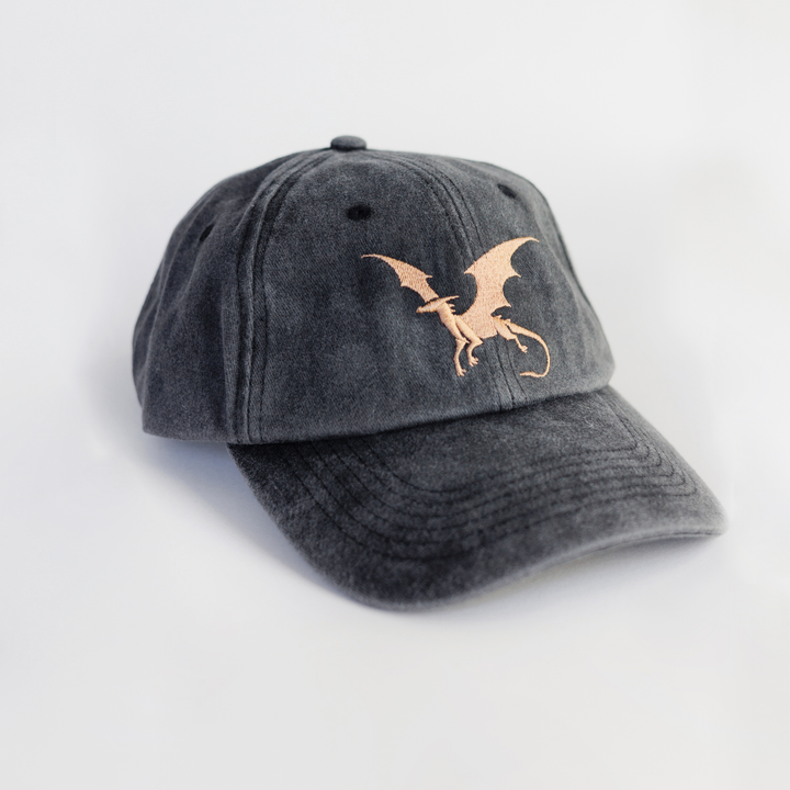 Gray cap with a gold dragon emblem on a light gray background