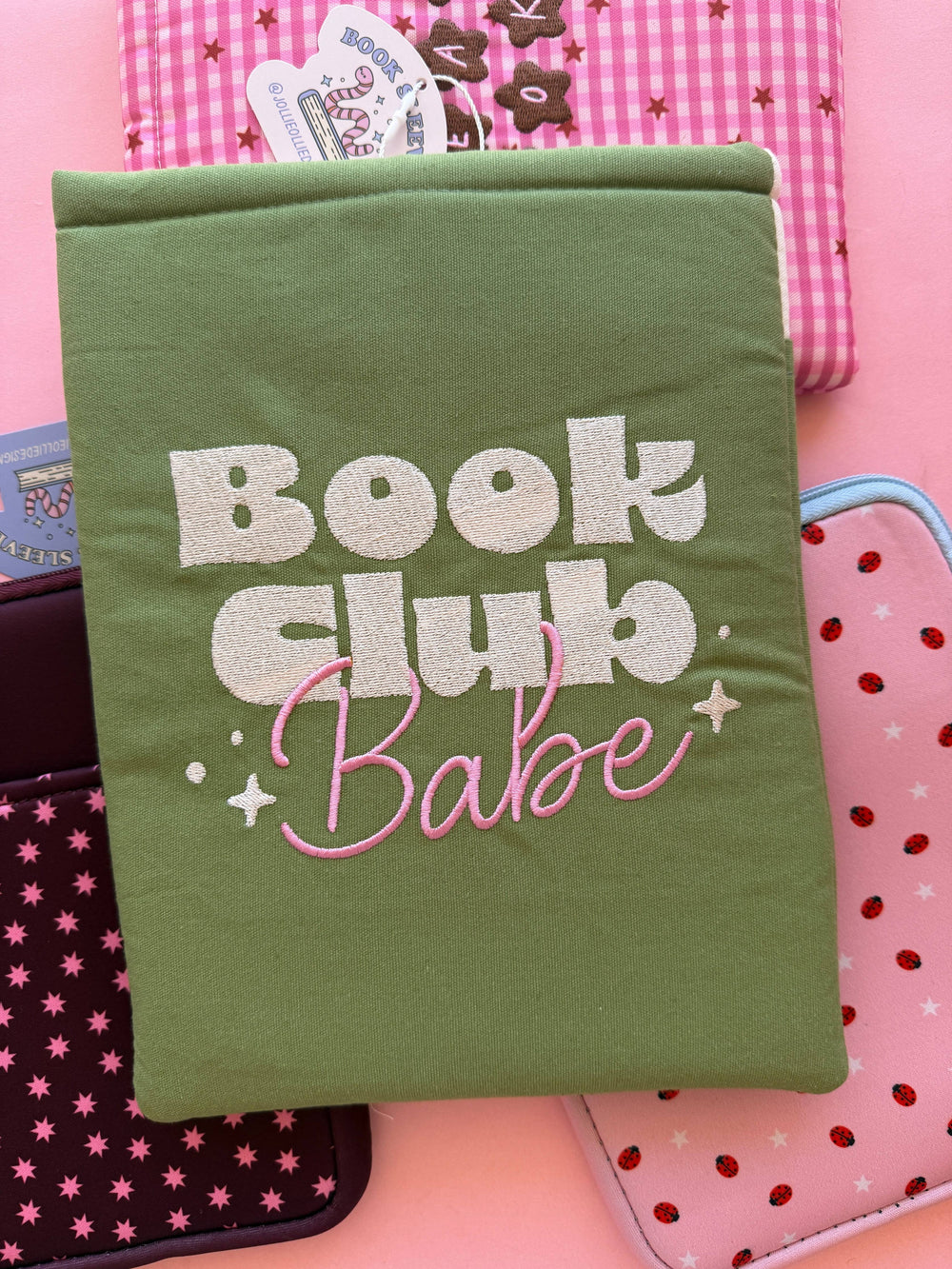 Green notebook with 'Book Club Babe' text on a pink background