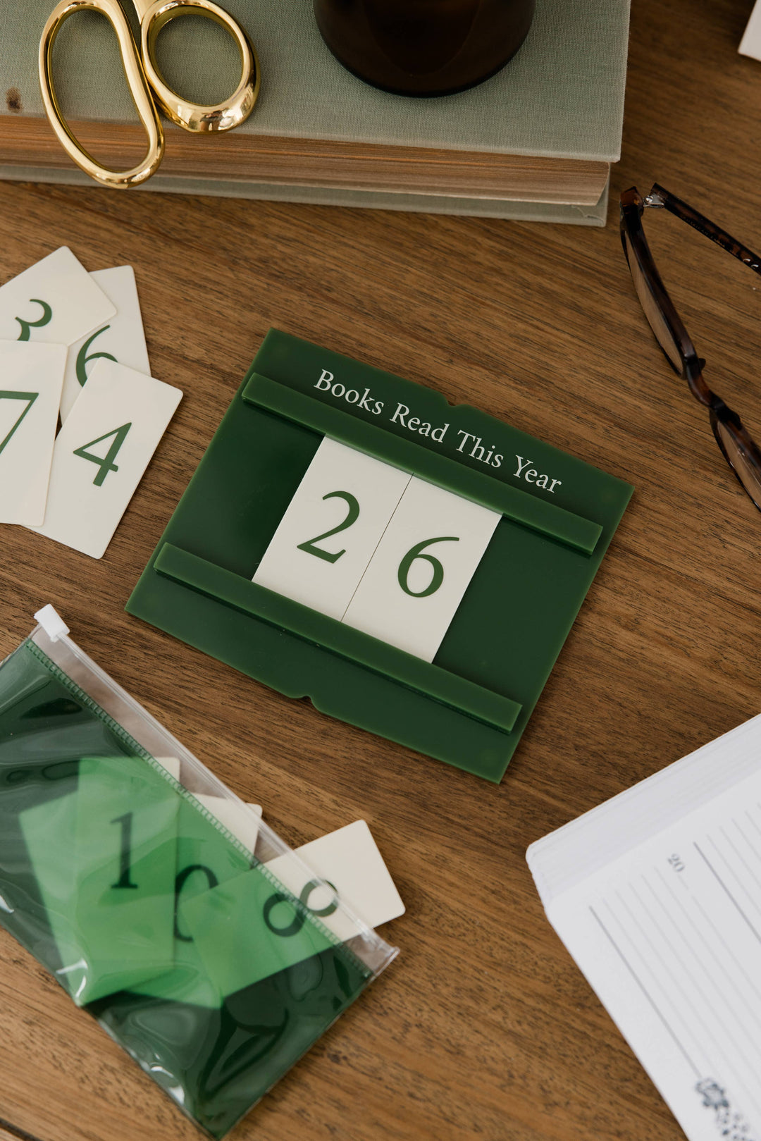 A dark green calendar block displaying &