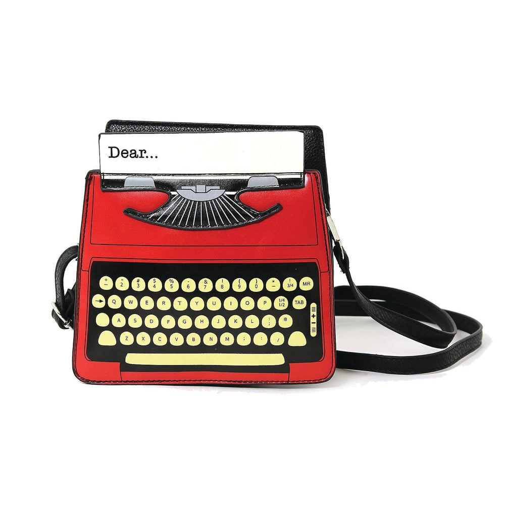 Red typewriter-shaped handbag with a black handle on a white background