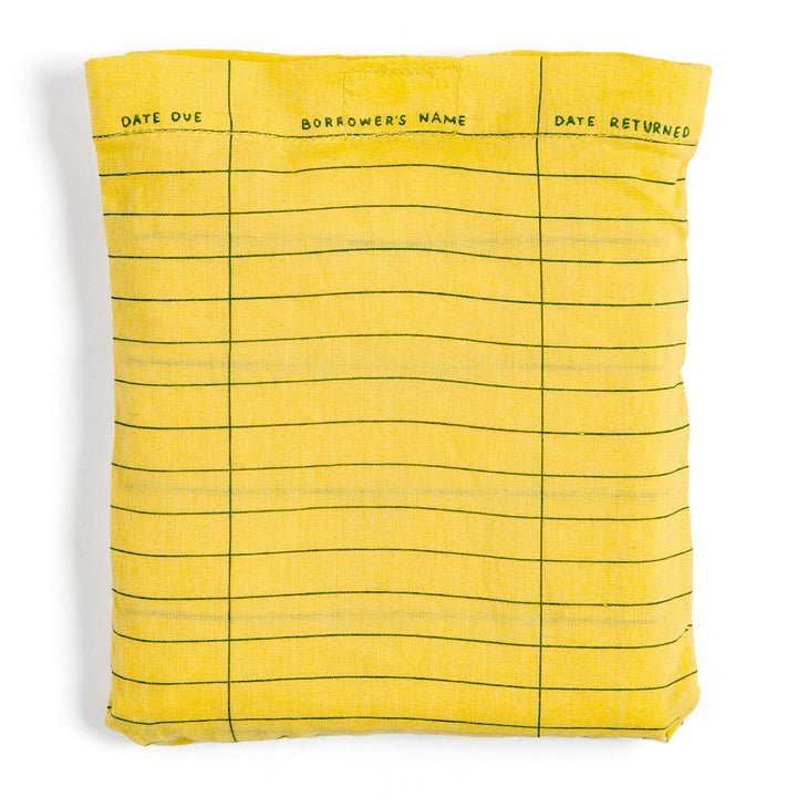 Yellow fabric with grid pattern resembling a checkbook cover on a white background
