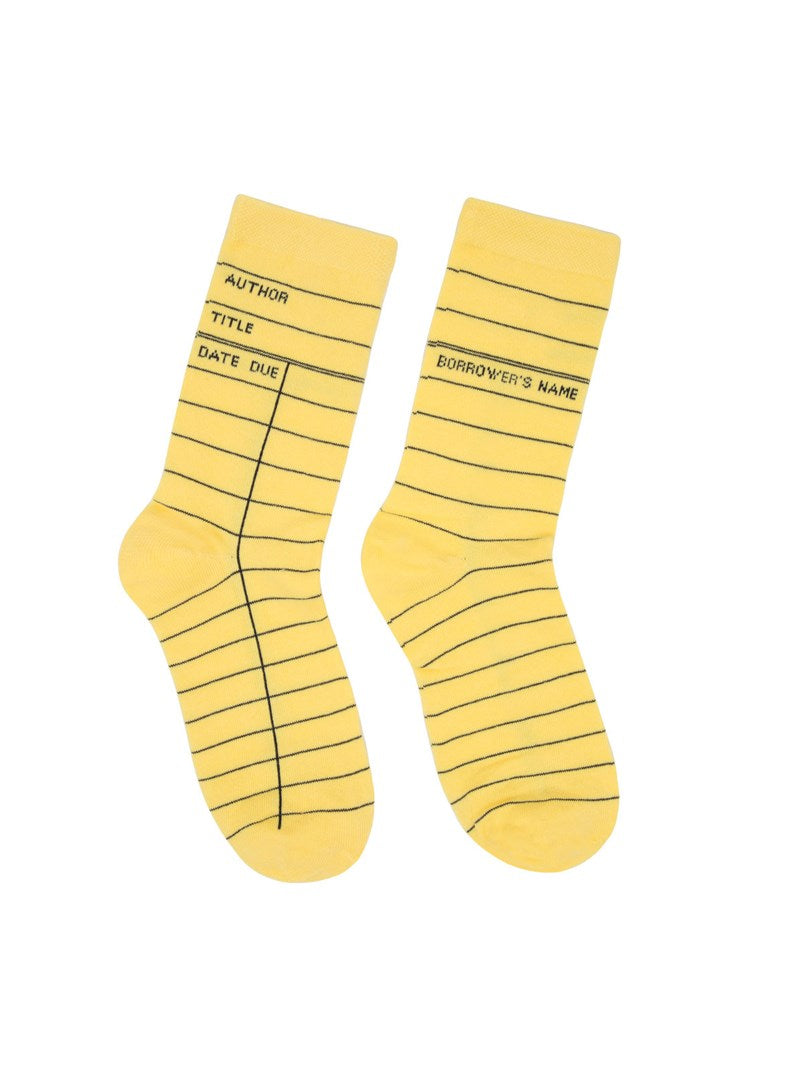Yellow socks with black text and lines on a white background
