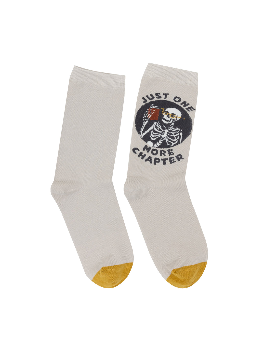 White socks with a skeleton design and text 'Just One More Chapter' on a white background