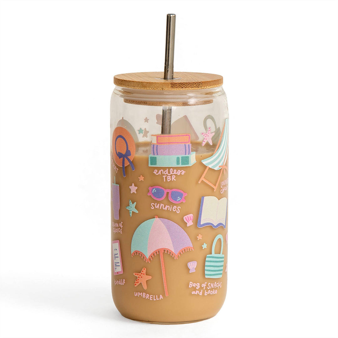 Tumbler with beach-themed illustrations and a wooden lid on a white background