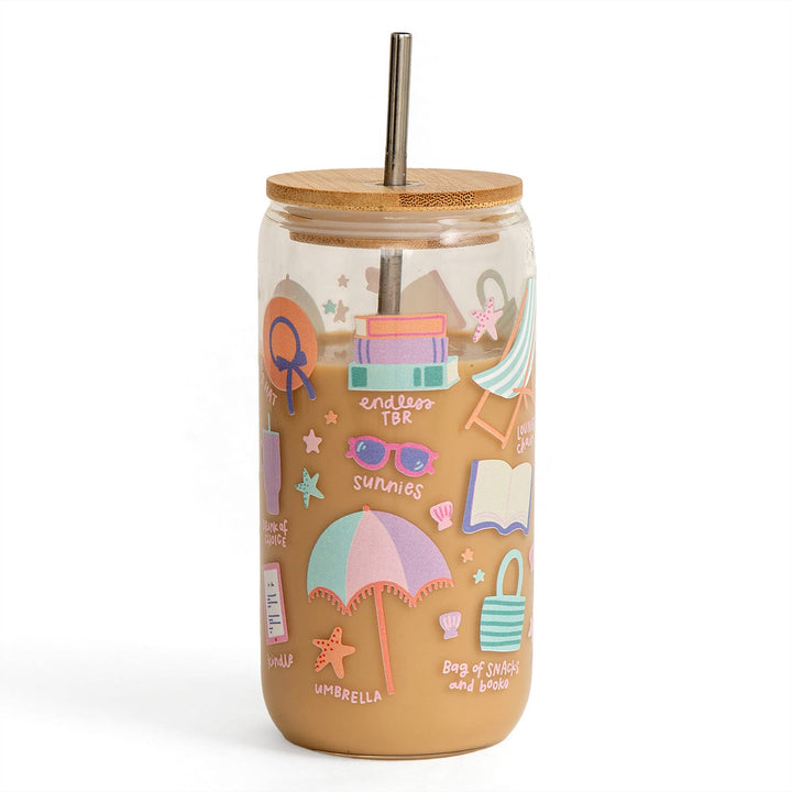 Tumbler with beach-themed illustrations and a wooden lid on a white background