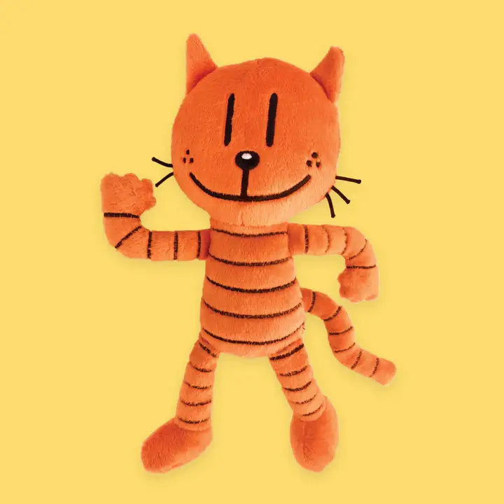 Plush tiger toy on a yellow background
