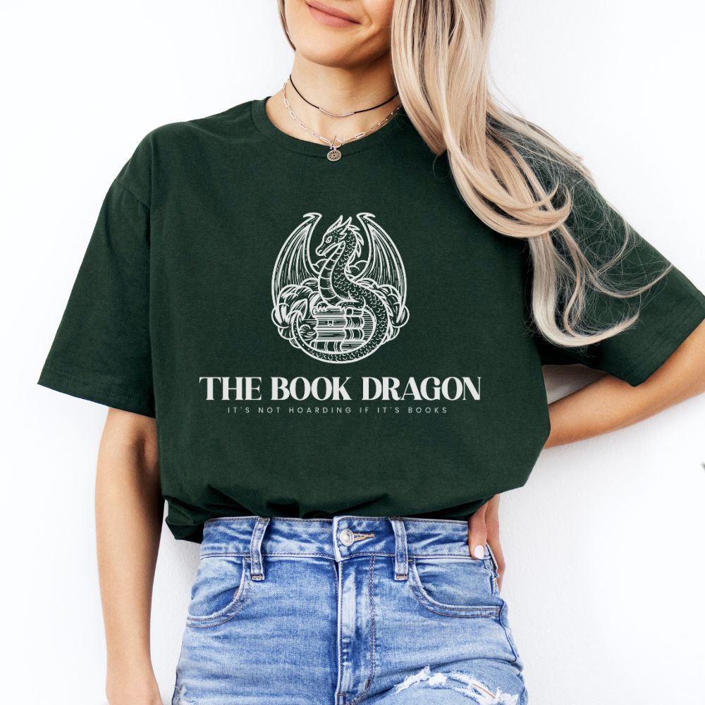 Person wearing a green t-shirt with 'The Book Dragon' design and text.