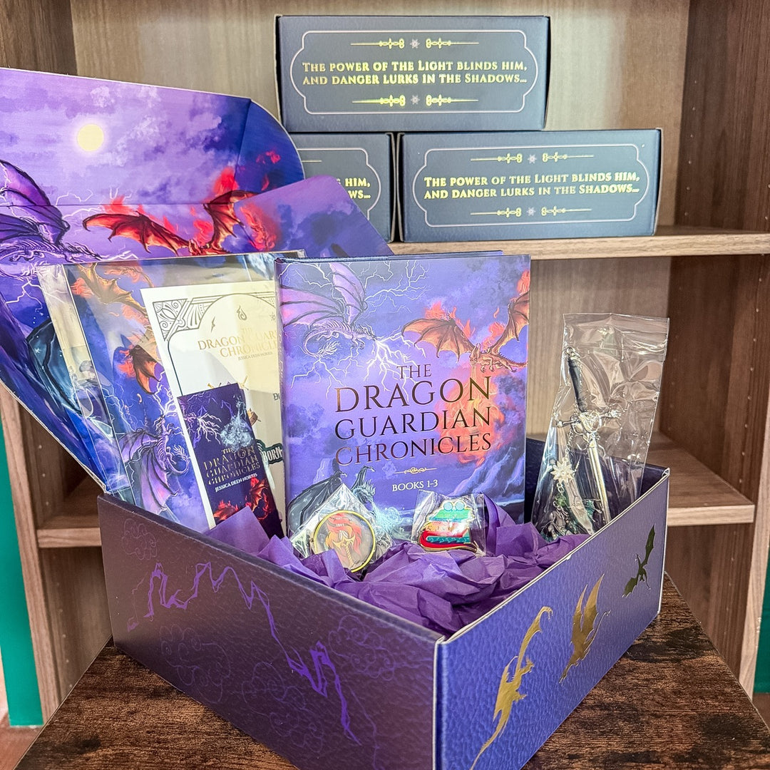 Open box containing 'The Dragon Guardian Chronicles' book set with dragon-themed packaging.