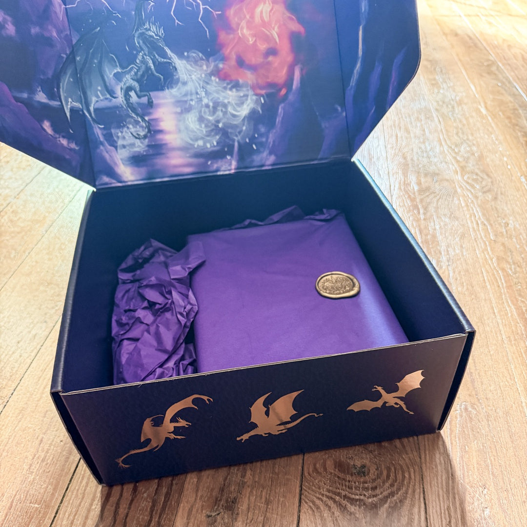 Purple tissue in a decorative box with dragon designs on a wooden surface