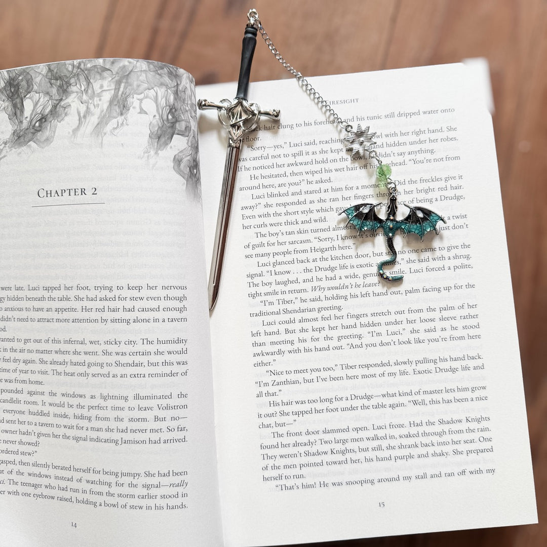 Decorative sword bookmark on an open book