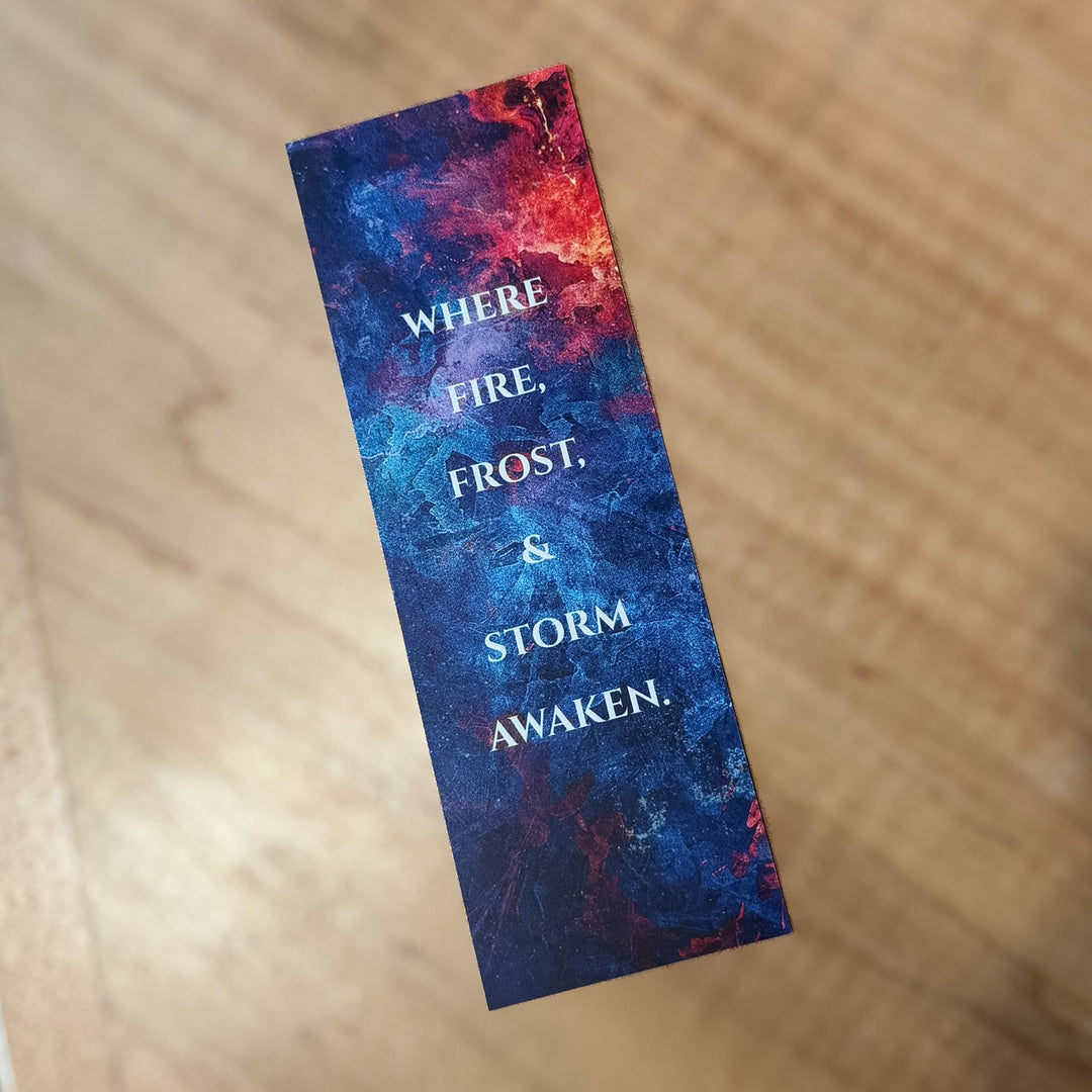 Colorful bookmark with text on a wooden surface. Text reads &