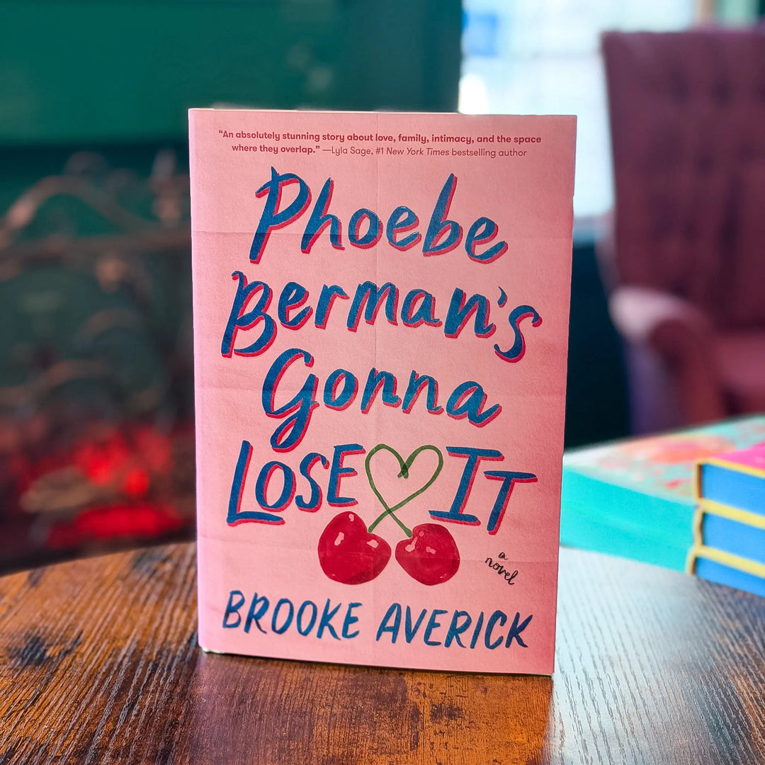 Book titled 'Phoebe Berman's Gonna Lose It' by Brooke Averick on a wooden table.