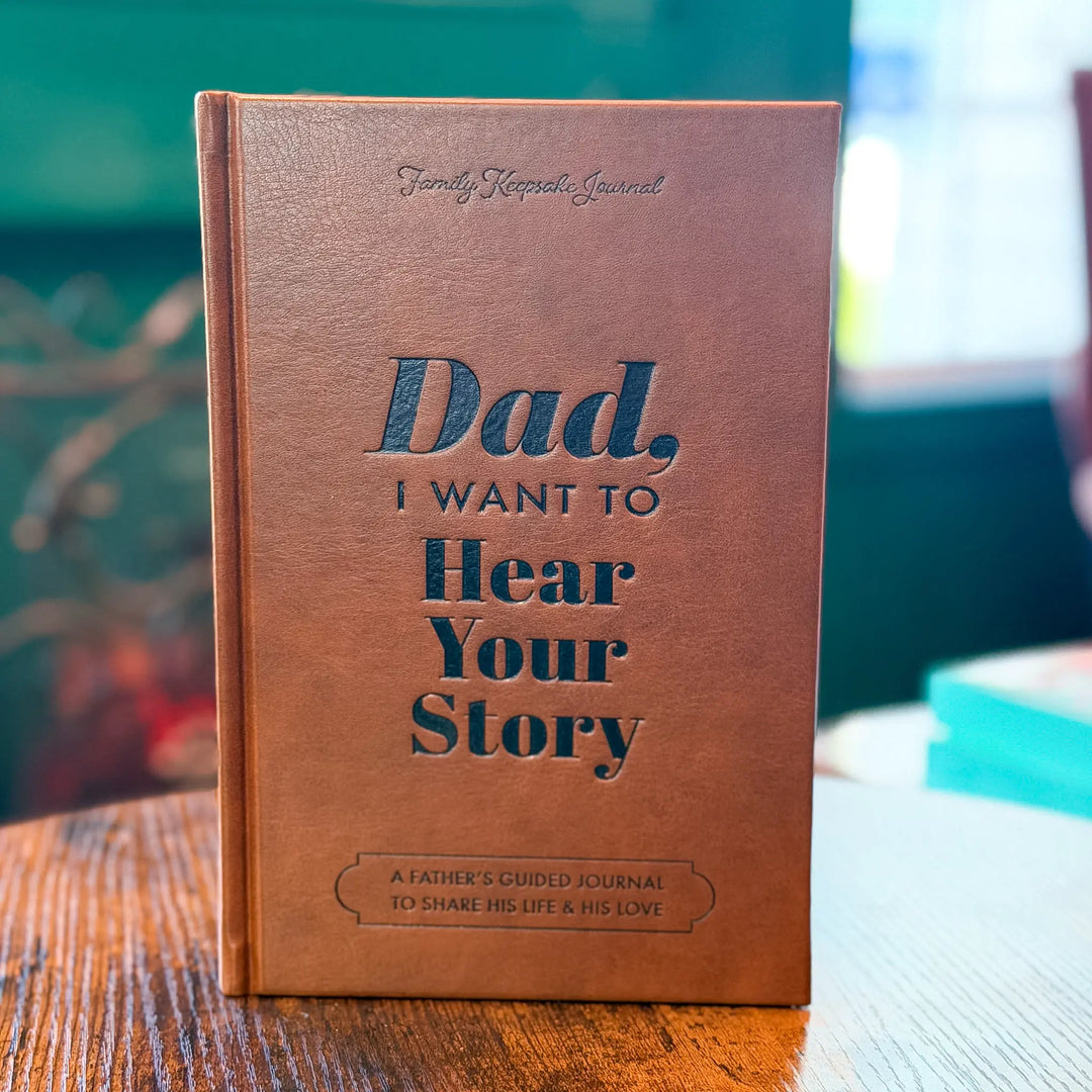 Brown journal with text on a wooden surface