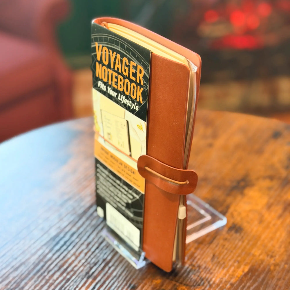 Voyager Notebook on a stand with a blurred background