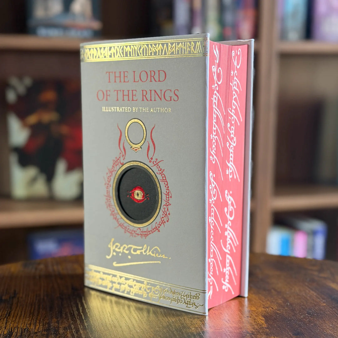 Book titled 'The Lord of the Rings' with decorative cover design on a wooden surface.