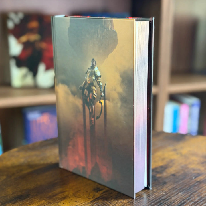 Book with a cover featuring a robot on a wooden surface with a blurred background