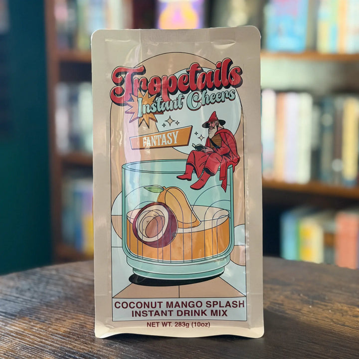 Instant drink mix packet with colorful label on a wooden surface