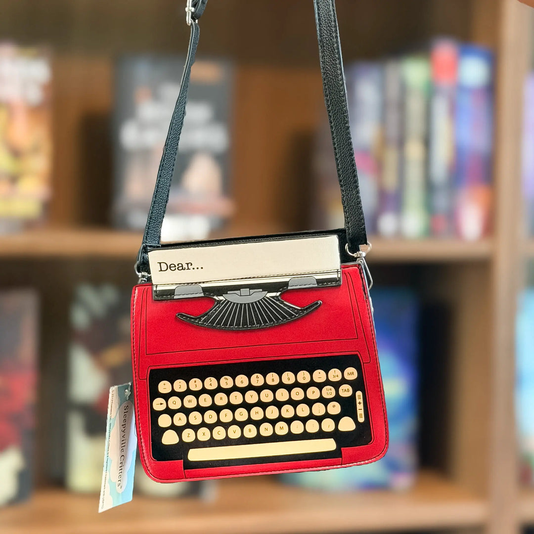 Red typewriter-shaped handbag with a black handle