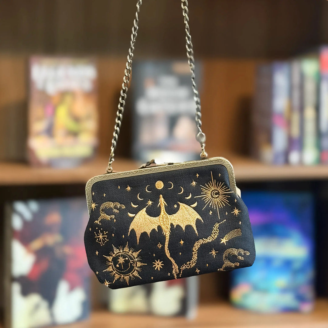 Black clutch bag with gold dragon and celestial designs
