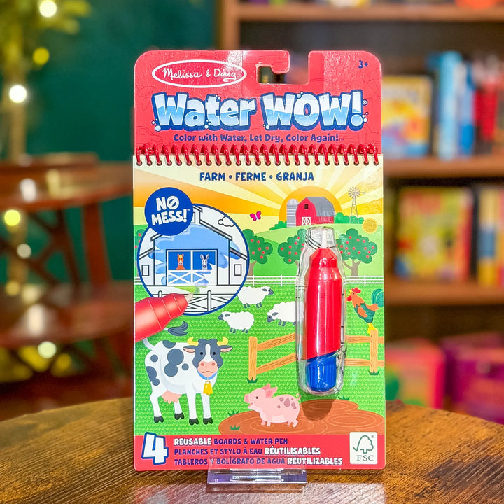 Melissa &amp; Doug Water WOW! Farm themed coloring book and water pen set packaging on a wooden surface.