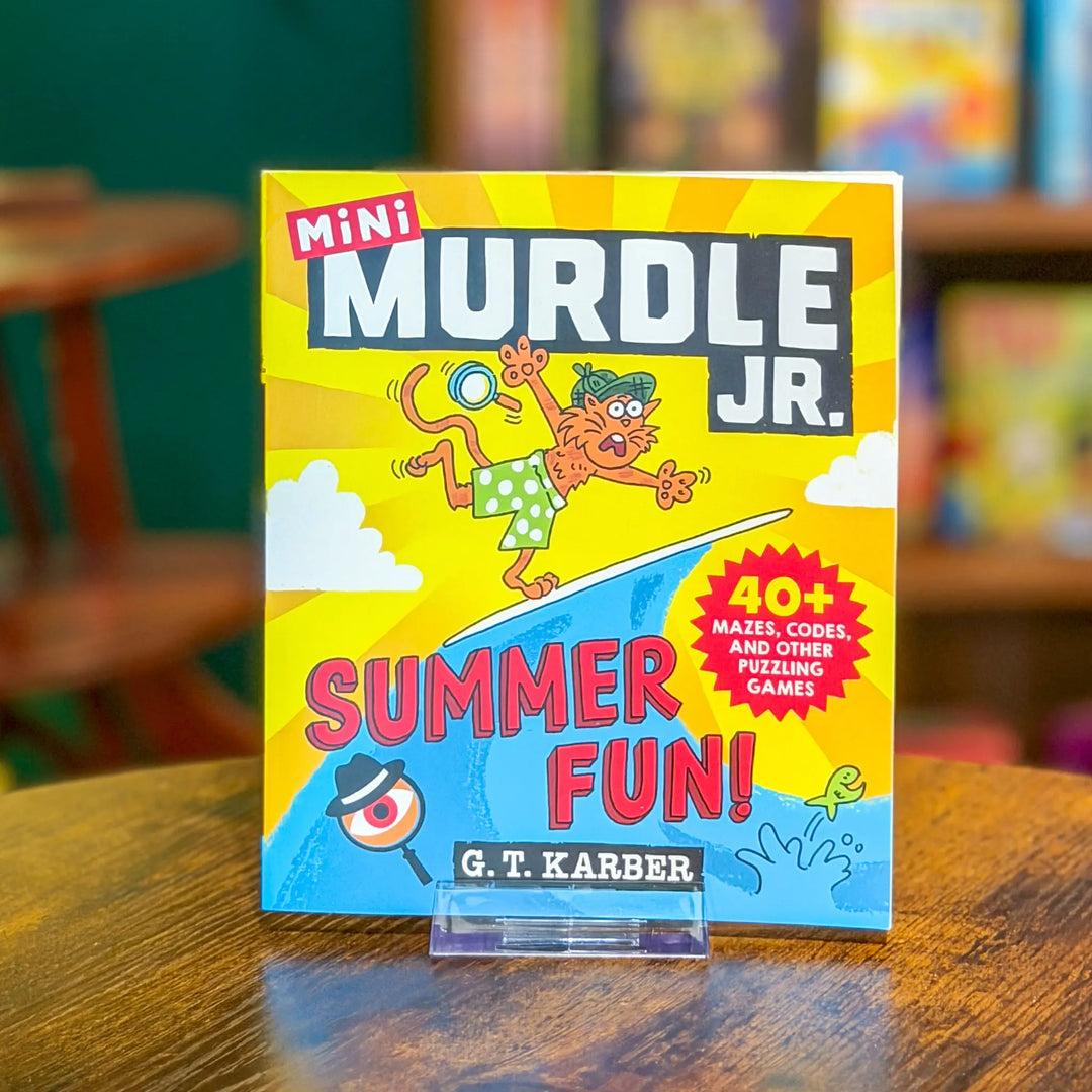 Mini MURDLE JR. book on a wooden table with a colorful cover