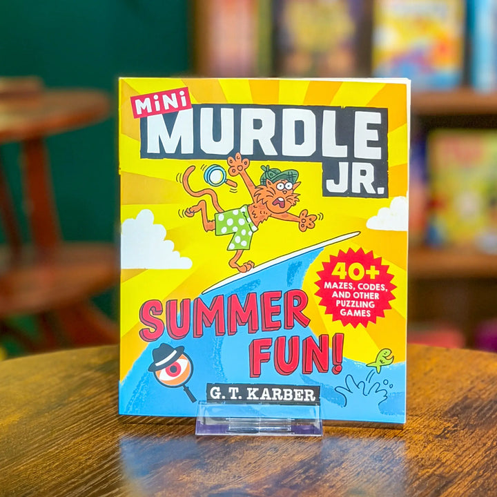Mini MURDLE JR. book on a wooden table with a colorful cover
