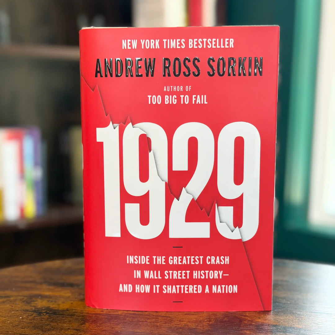 Book titled '1929' by Andrew Ross Sorkin on a wooden surface with a blurred background