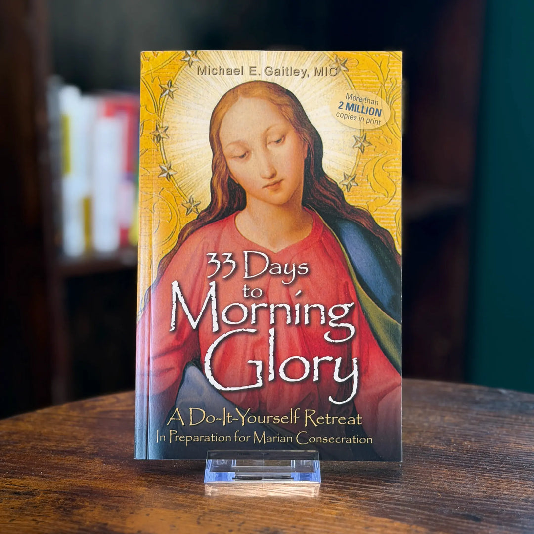 Book titled '33 Days to Morning Glory' on a wooden surface with a blurred background