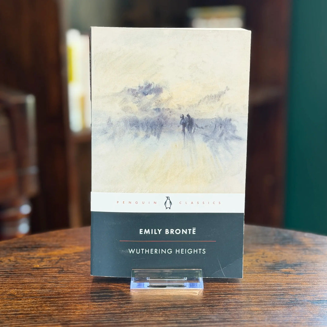 Book titled 'Wuthering Heights' by Emily Bronte on a wooden table